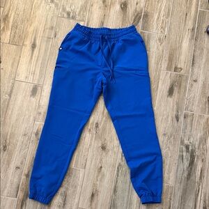 Jaanuu Vibrant Blue Joggers and top. In medium